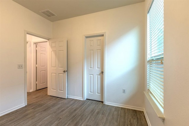9005 Pin Brush Dr, Austin, TX 78748 - unfurnished bedroom featuring wood finished floors and baseboards