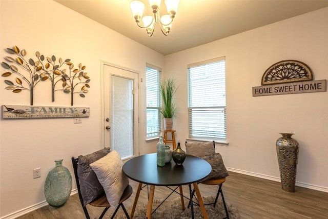 9005 Pin Brush Dr, Austin, TX 78748 - dining space with a chandelier, dark wood-type flooring, and baseboards