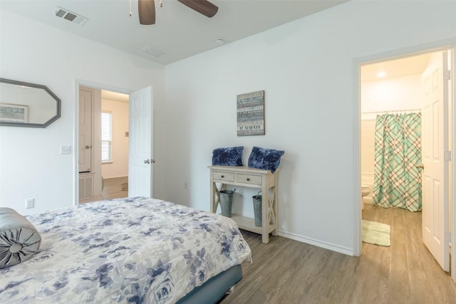 9005 Pin Brush Dr, Austin, TX 78748 - bedroom with light wood-style flooring, connected bathroom, baseboards, and a ceiling fan