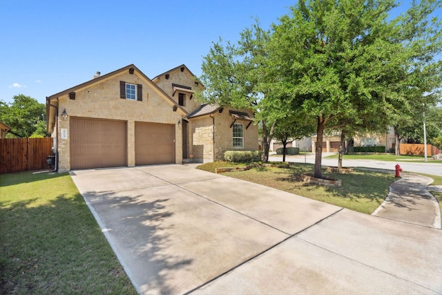 view of front of home with stone siding, concrete driveway, and a garage