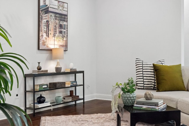 living area featuring wood finished floors and baseboards