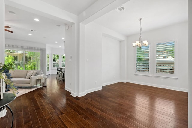 dining area featuring a chandelier, baseboards, wood finished floors, ceiling fan, and recessed lighting
