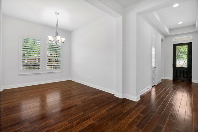 foyer entrance with a chandelier, dark wood-type flooring, baseboards, and recessed lighting