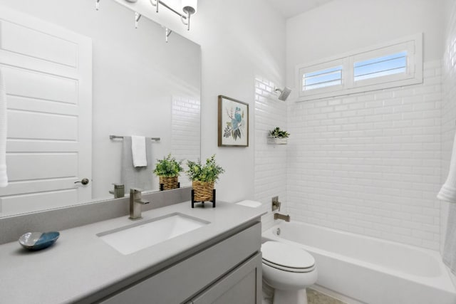 full bathroom featuring toilet, bathtub / shower combination, and vanity