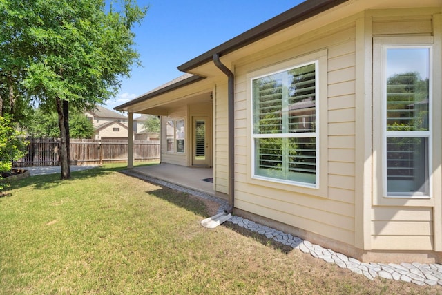 view of side of property with a patio