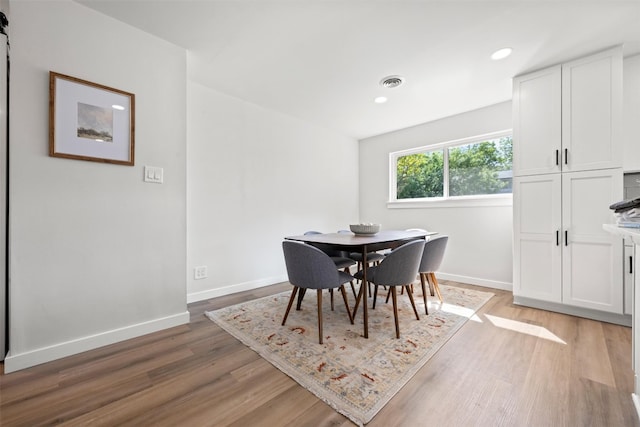 616 Bissonet Ln, Austin, TX 78752 - dining area with light wood-style floors and recessed lighting