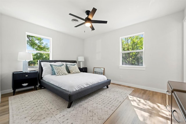 616 Bissonet Ln, Austin, TX 78752 - bedroom with light wood-type flooring and a ceiling fan