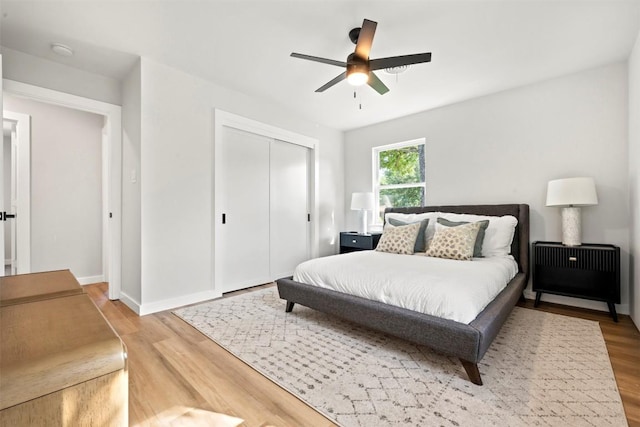 616 Bissonet Ln, Austin, TX 78752 - bedroom featuring wood finished floors, a closet, and ceiling fan