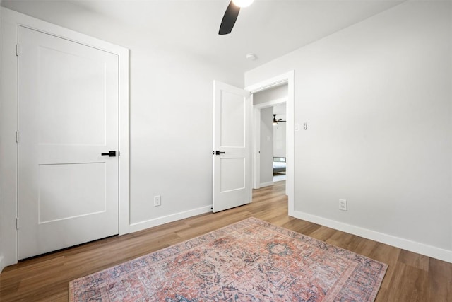 616 Bissonet Ln, Austin, TX 78752 - unfurnished bedroom featuring wood finished floors and a ceiling fan