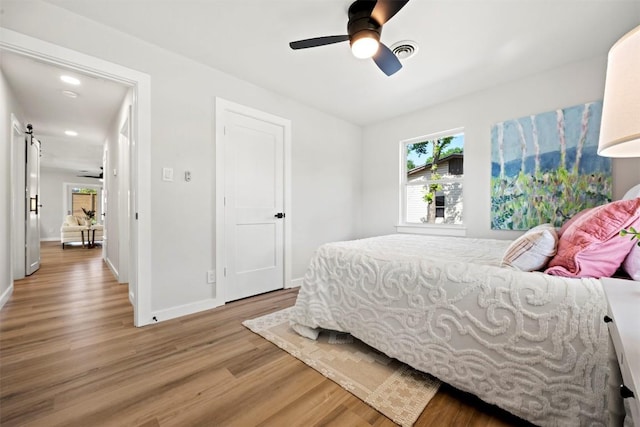 616 Bissonet Ln, Austin, TX 78752 - bedroom with light wood finished floors and a ceiling fan