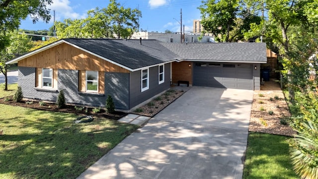 616 Bissonet Ln, Austin, TX 78752 - view of front of property featuring a shingled roof, concrete driveway, a garage, a front yard, and brick siding