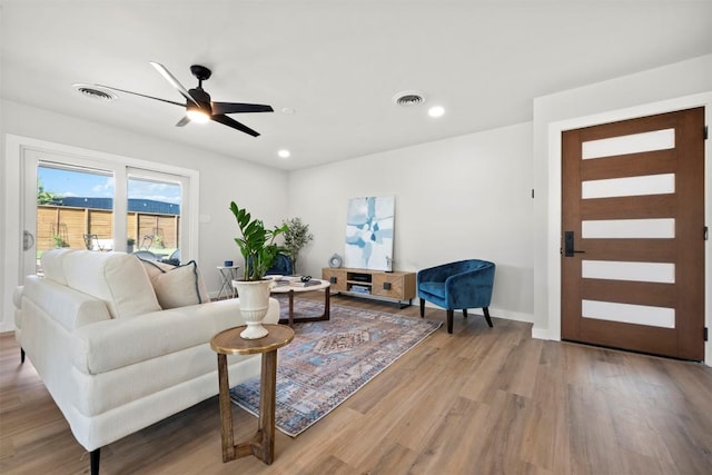 616 Bissonet Ln, Austin, TX 78752 - living room with wood finished floors, ceiling fan, and recessed lighting