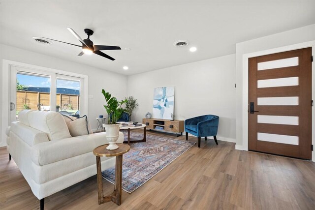 616 Bissonet Ln, Austin, TX 78752 - living area featuring wood finished floors, a ceiling fan, and recessed lighting
