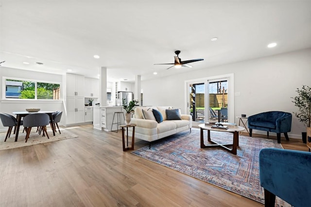 616 Bissonet Ln, Austin, TX 78752 - living area featuring light wood-style floors, a ceiling fan, and recessed lighting