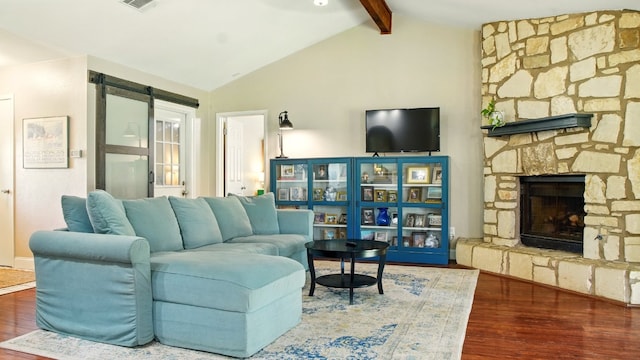 708 Chestnut Xing, Cedar Park, TX 78613 - living area with wood finished floors, a barn door, and a fireplace