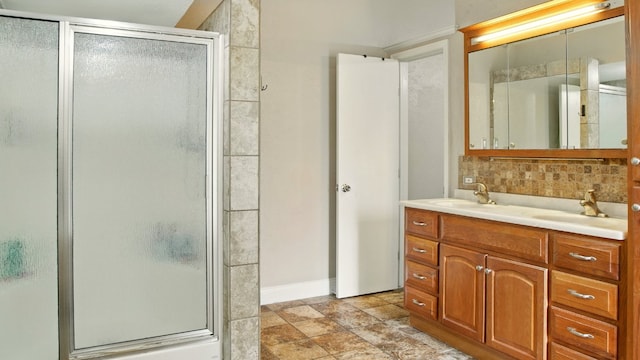 708 Chestnut Xing, Cedar Park, TX 78613 - full bath featuring tasteful backsplash, a shower stall, vanity, baseboards, and stone finish flooring