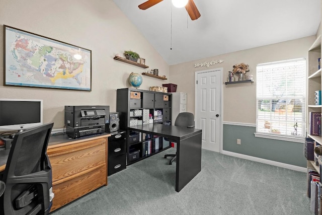 home office featuring vaulted ceiling, carpet flooring, a ceiling fan, and baseboards