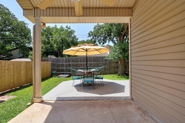 view of patio with outdoor dining space and a deck