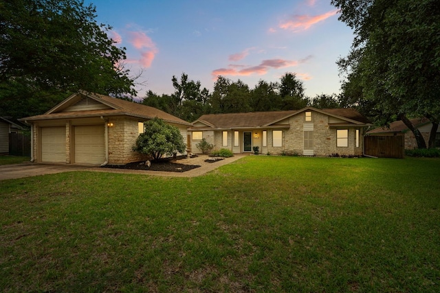 view of front of house with stone siding and driveway