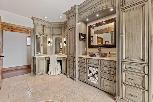bathroom with baseboards and vanity
