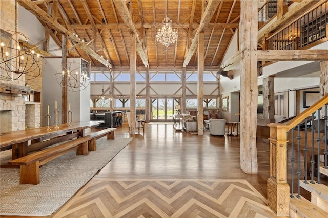 common area featuring high vaulted ceiling, beamed ceiling, and wooden ceiling
