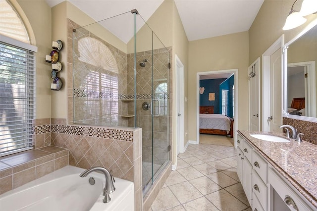 2025 Saint Andrews Dr, Round Rock, TX 78664 - ensuite bathroom featuring a garden tub, a shower stall, vanity, and tile patterned flooring