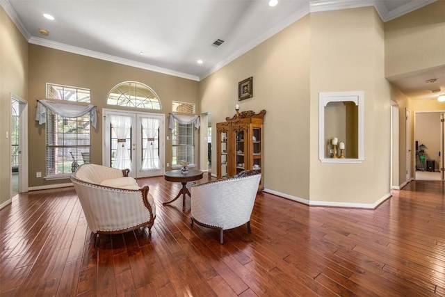 2025 Saint Andrews Dr, Round Rock, TX 78664 - living area featuring french doors, a towering ceiling, wood-type flooring, baseboards, and ornamental molding