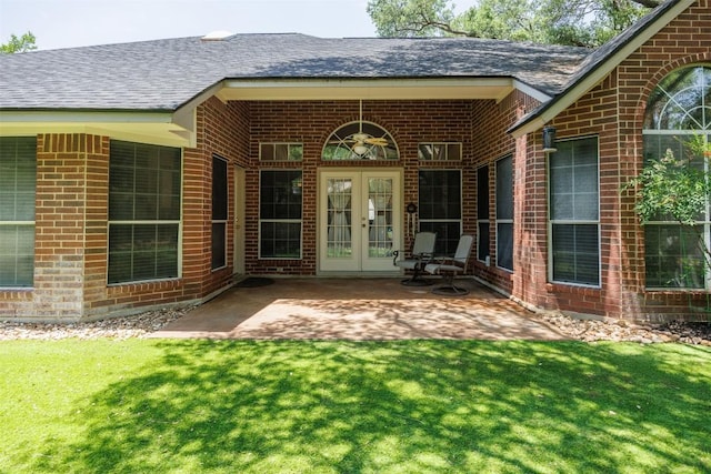 2025 Saint Andrews Dr, Round Rock, TX 78664 - property entrance with french doors, brick siding, and a patio