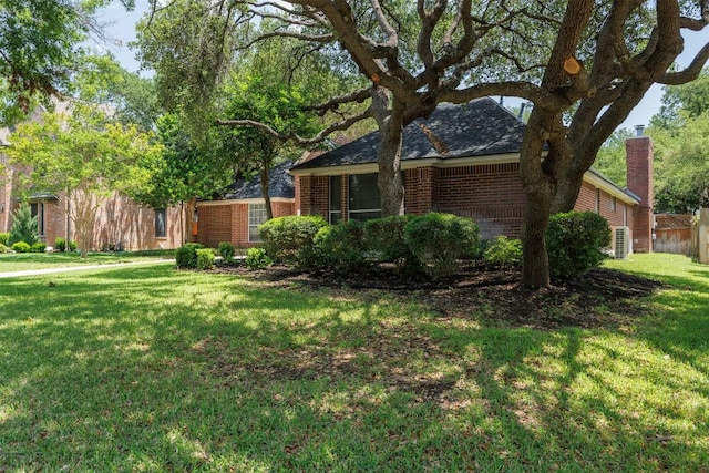 2025 Saint Andrews Dr, Round Rock, TX 78664 - view of grassy yard featuring central air condition unit
