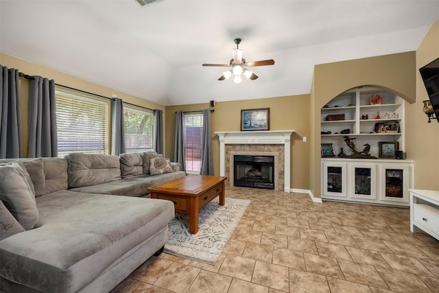 2025 Saint Andrews Dr, Round Rock, TX 78664 - living room featuring a ceiling fan, vaulted ceiling, and a fireplace