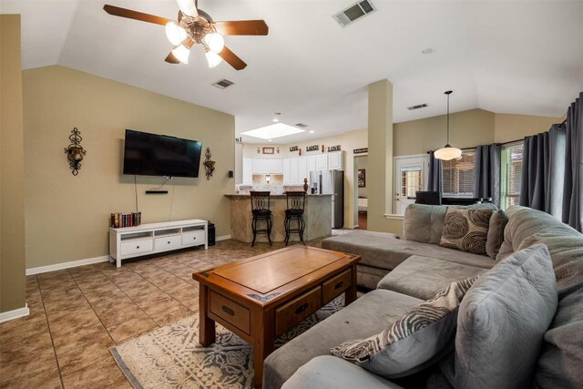 2025 Saint Andrews Dr, Round Rock, TX 78664 - living area featuring lofted ceiling, a ceiling fan, baseboards, and light tile patterned floors