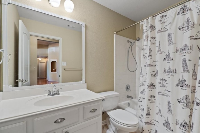 2025 Saint Andrews Dr, Round Rock, TX 78664 - bathroom featuring vanity, toilet, shower / bath combo with shower curtain, and a textured wall