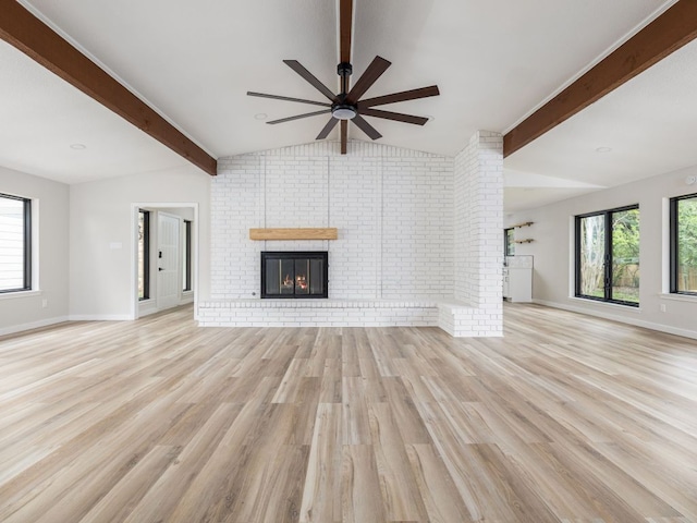 1168 Mildred Lee Ln, Harker Heights, TX 76548 - unfurnished living room featuring ceiling fan, light wood-style flooring, a fireplace, and brick wall