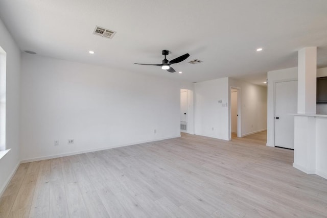 303 Flinn St, Hutto, TX 78634 - unfurnished living room with light wood-style floors, a ceiling fan, recessed lighting, and baseboards