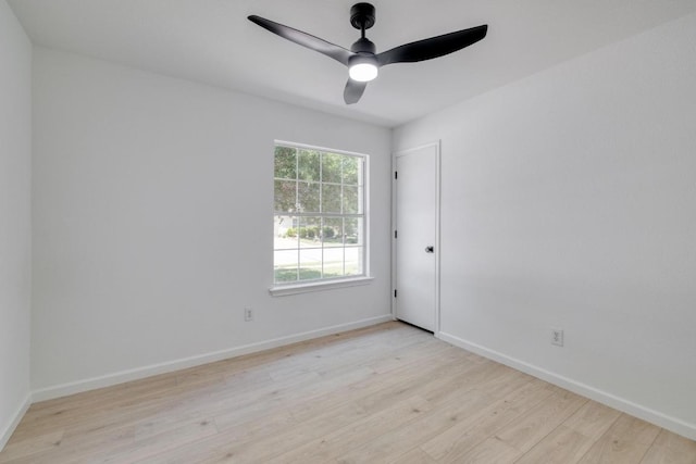 303 Flinn St, Hutto, TX 78634 - unfurnished room featuring light wood-style floors, a ceiling fan, and baseboards