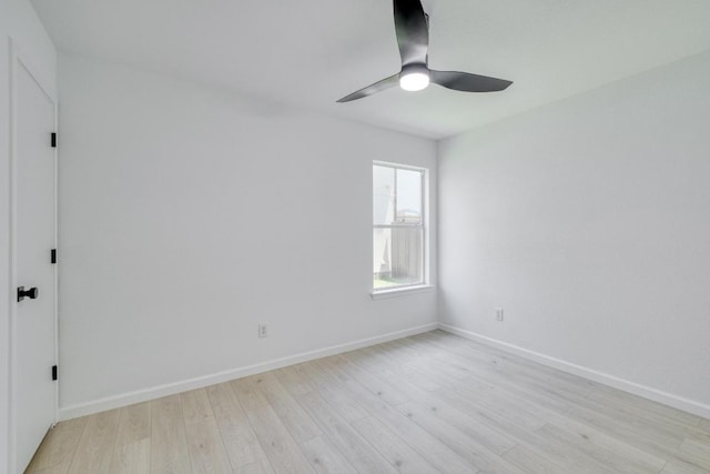 303 Flinn St, Hutto, TX 78634 - spare room with a ceiling fan, light wood finished floors, and baseboards