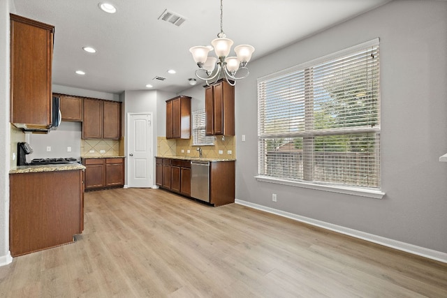 kitchen featuring a chandelier, dishwasher, backsplash, light wood-style flooring, and recessed lighting