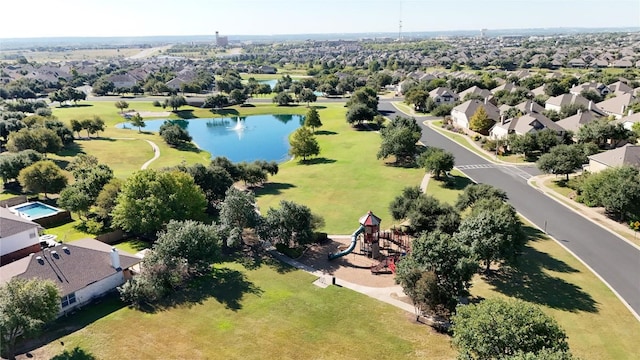 aerial perspective of suburban area featuring a nearby body of water