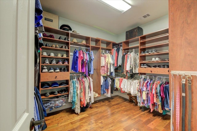 spacious closet featuring wood finished floors
