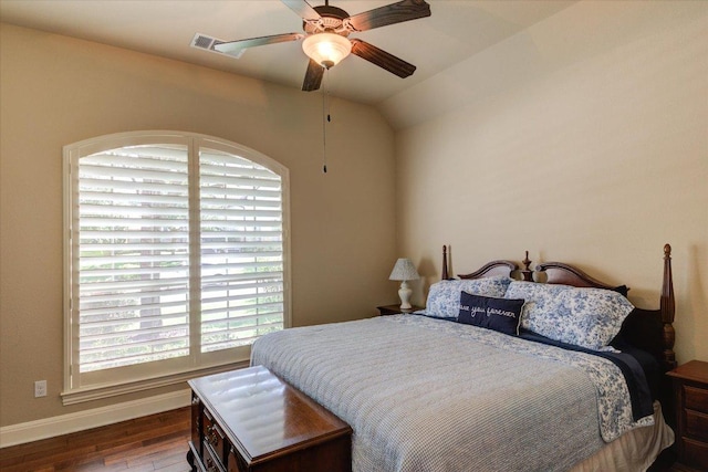 bedroom featuring wood finished floors, baseboards, ceiling fan, and lofted ceiling