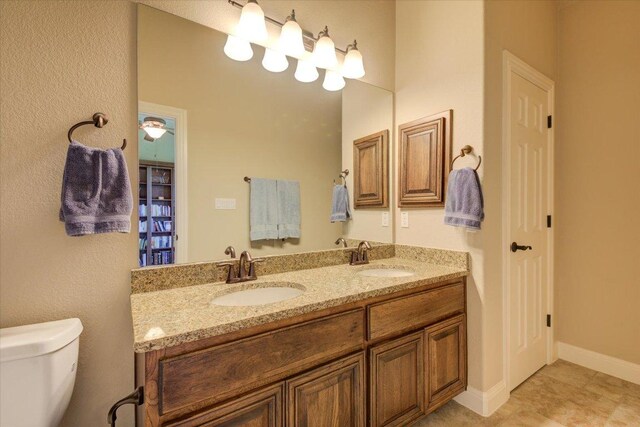 3920 Vail Dv, Bee Cave, TX 78738 - full bath featuring double vanity, toilet, and a closet