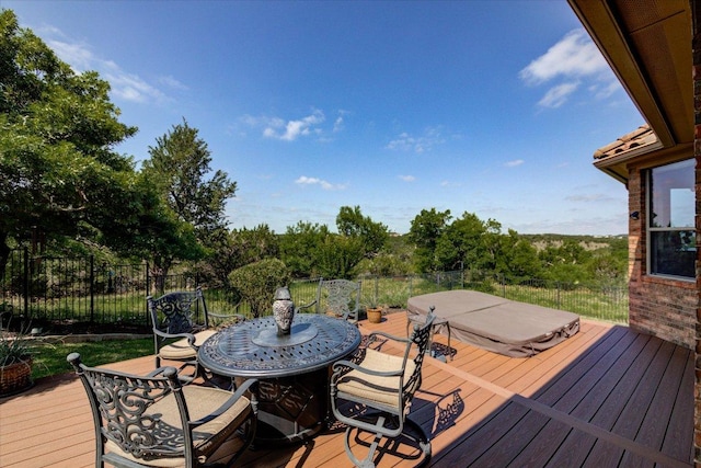 wooden terrace featuring outdoor dining area and fence