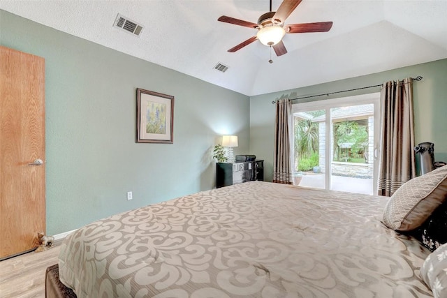 9840 N Live Oak Rd, Salado, TX 76571 - bedroom featuring access to exterior, vaulted ceiling, light wood-type flooring, and a ceiling fan
