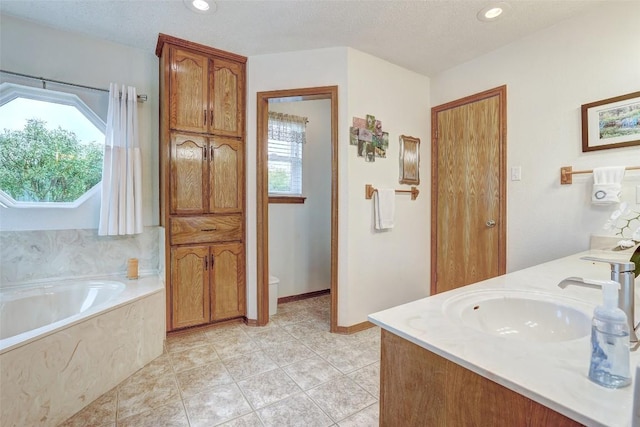 9840 N Live Oak Rd, Salado, TX 76571 - full bath featuring a bath, tile patterned floors, double vanity, and recessed lighting