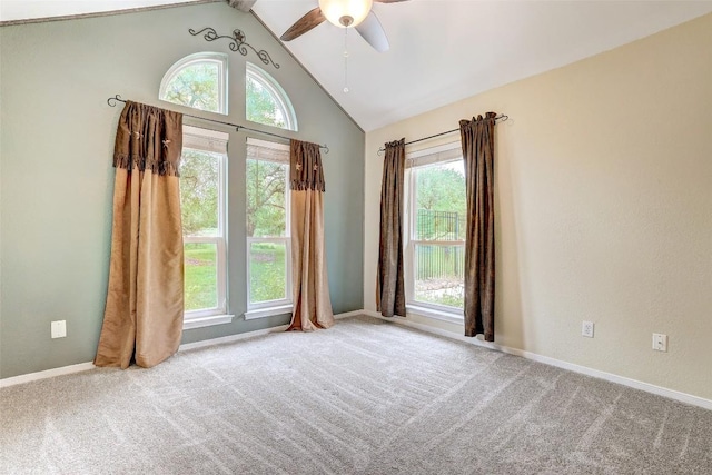 9840 N Live Oak Rd, Salado, TX 76571 - empty room with plenty of natural light, ceiling fan, carpet, baseboards, and high vaulted ceiling