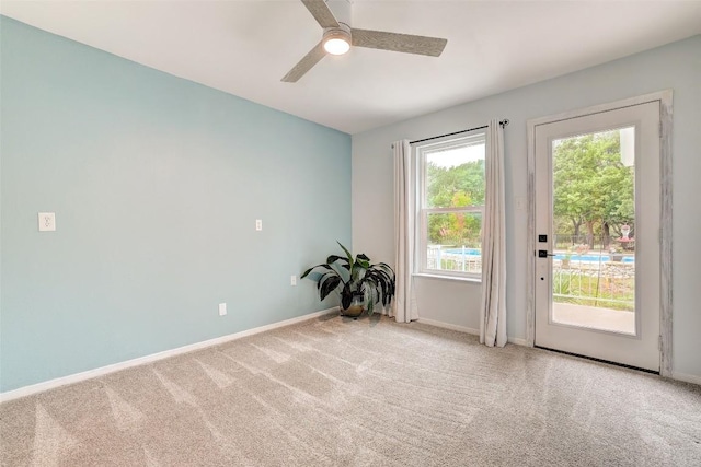 9840 N Live Oak Rd, Salado, TX 76571 - doorway to outside featuring carpet floors, baseboards, and ceiling fan
