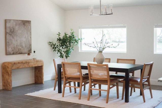 4535 Pack Saddle Pass, Austin, TX 78745 - dining space featuring a chandelier and baseboards