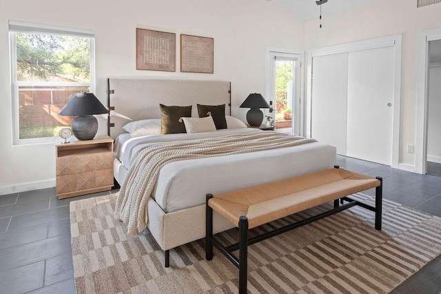 4535 Pack Saddle Pass, Austin, TX 78745 - bedroom with baseboards, a closet, and lofted ceiling