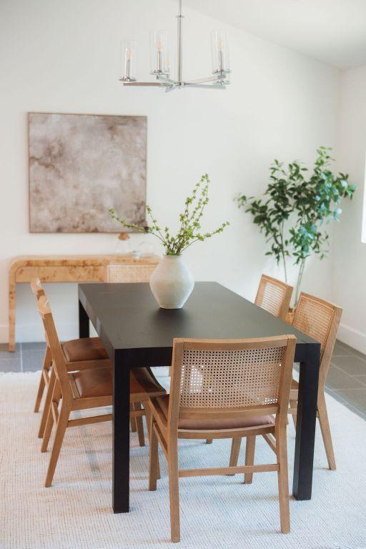 4535 Pack Saddle Pass, Austin, TX 78745 - dining space featuring a chandelier and baseboards