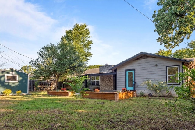 4535 Pack Saddle Pass, Austin, TX 78745 - rear view of property with a chimney